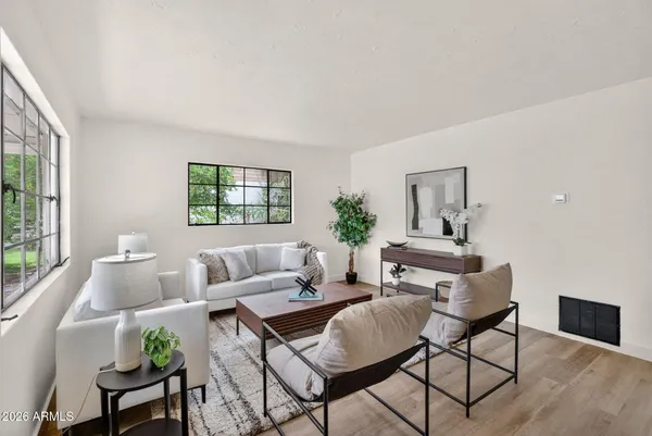 a living room with furniture and a window