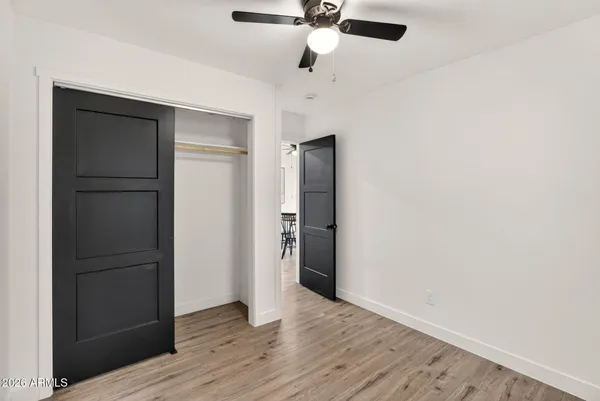 a backyard of a house with plants and trees