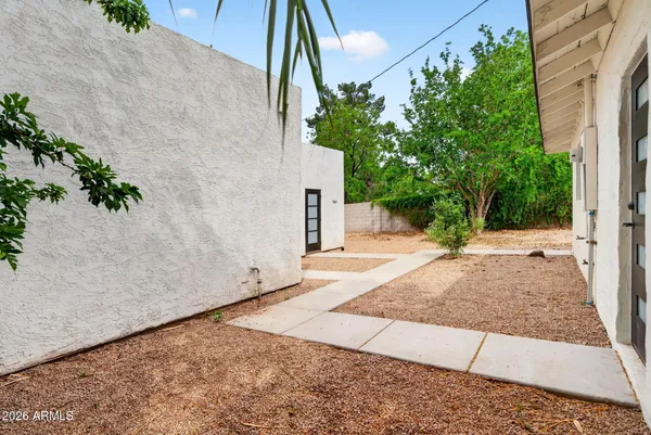 an aerial view of a house with yard swimming pool and outdoor seating