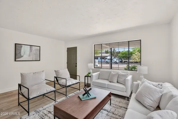 a living room with furniture and a window