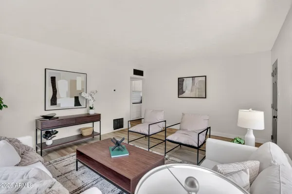 a kitchen with stainless steel appliances granite countertop a stove a sink dishwasher and a refrigerator with wooden cabinets