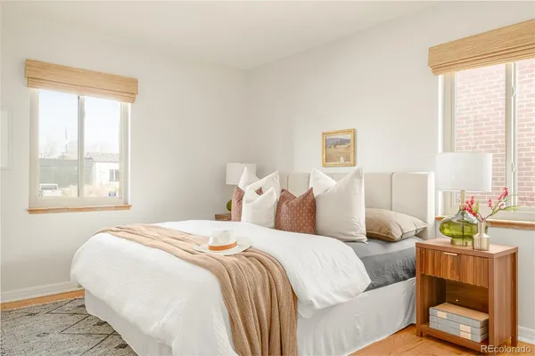 a bedroom with bed and window