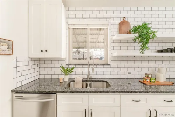a kitchen with sink and window