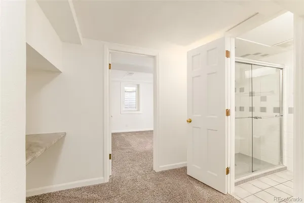 a bathroom with a shower and sink