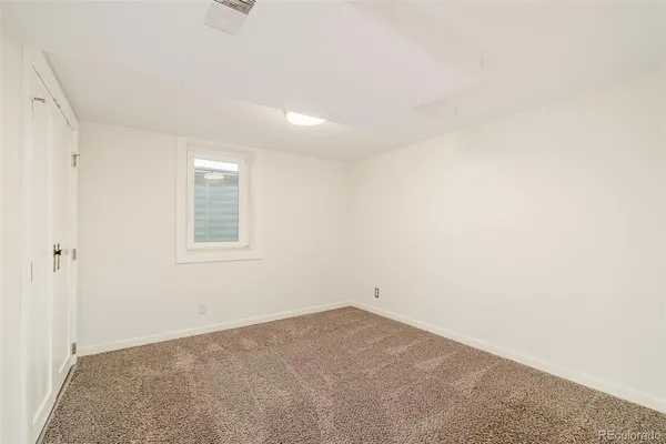 a view of a room that has a window in it