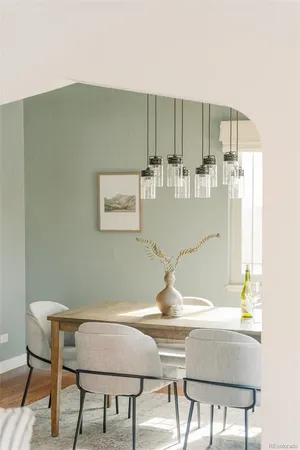 a view of a dining room with furniture and wooden floor