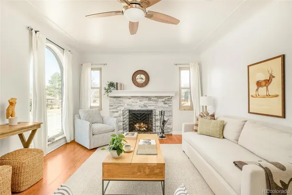 a living room with furniture and a fireplace
