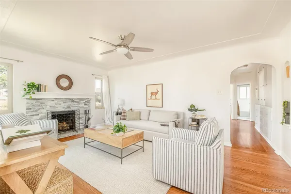 a living room with furniture and a fireplace