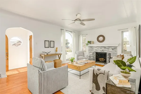 a living room with furniture and a fireplace