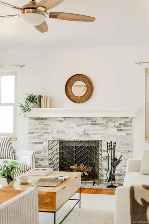 a living room with furniture and a fireplace
