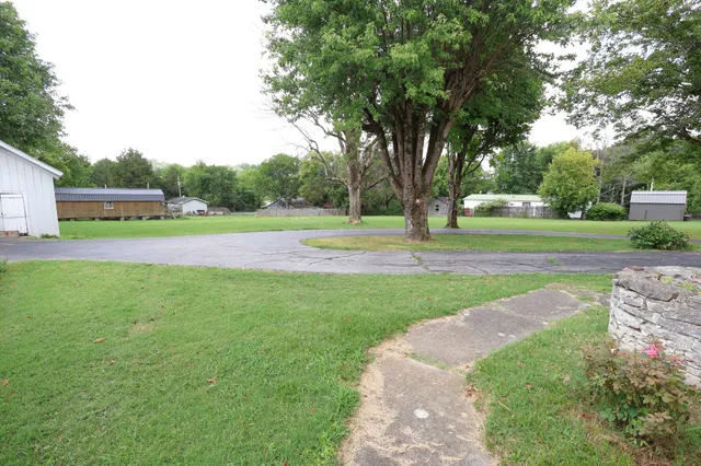 a view of outdoor space with deck and trees