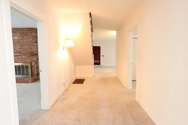 a view of a bathroom from a hallway