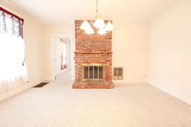 a big room with a fireplace in it