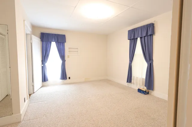 a bathroom with a sink mirror and shower