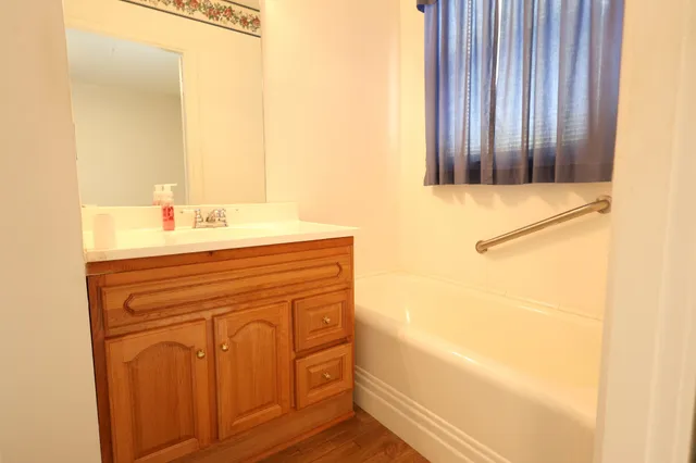 a view of storage and utility room with a window