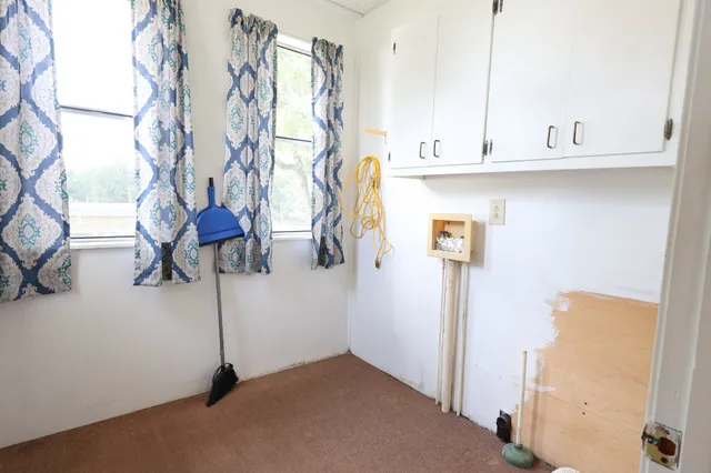 a view of hallway with windows