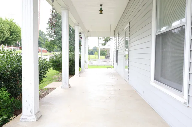 a view of a glass door with a yard