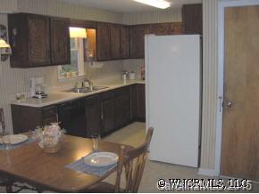 34 Westfield Road Fletcher, NC 28732 - Photo 7 of 12 a kitchen with a sink and a refrigerator