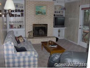 34 Westfield Road Fletcher, NC 28732 - Photo 8 of 12 a living room with furniture a flat screen tv and a fireplace