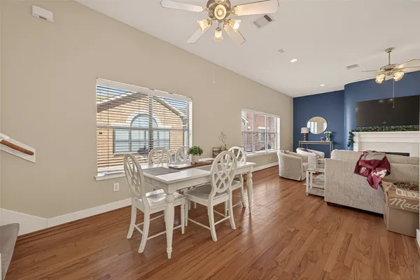 a view of a dining room with furniture window and wooden floor