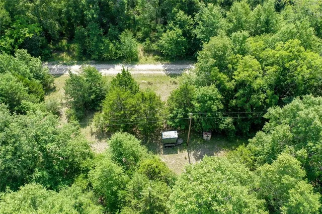 a view of a garden with a lake view