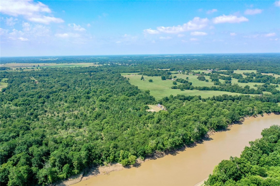 37.5 Antioch Road Midway, TX 75852 - Photo 9 of 24 an aerial view of a city with lots of residential buildings and mountain view in back