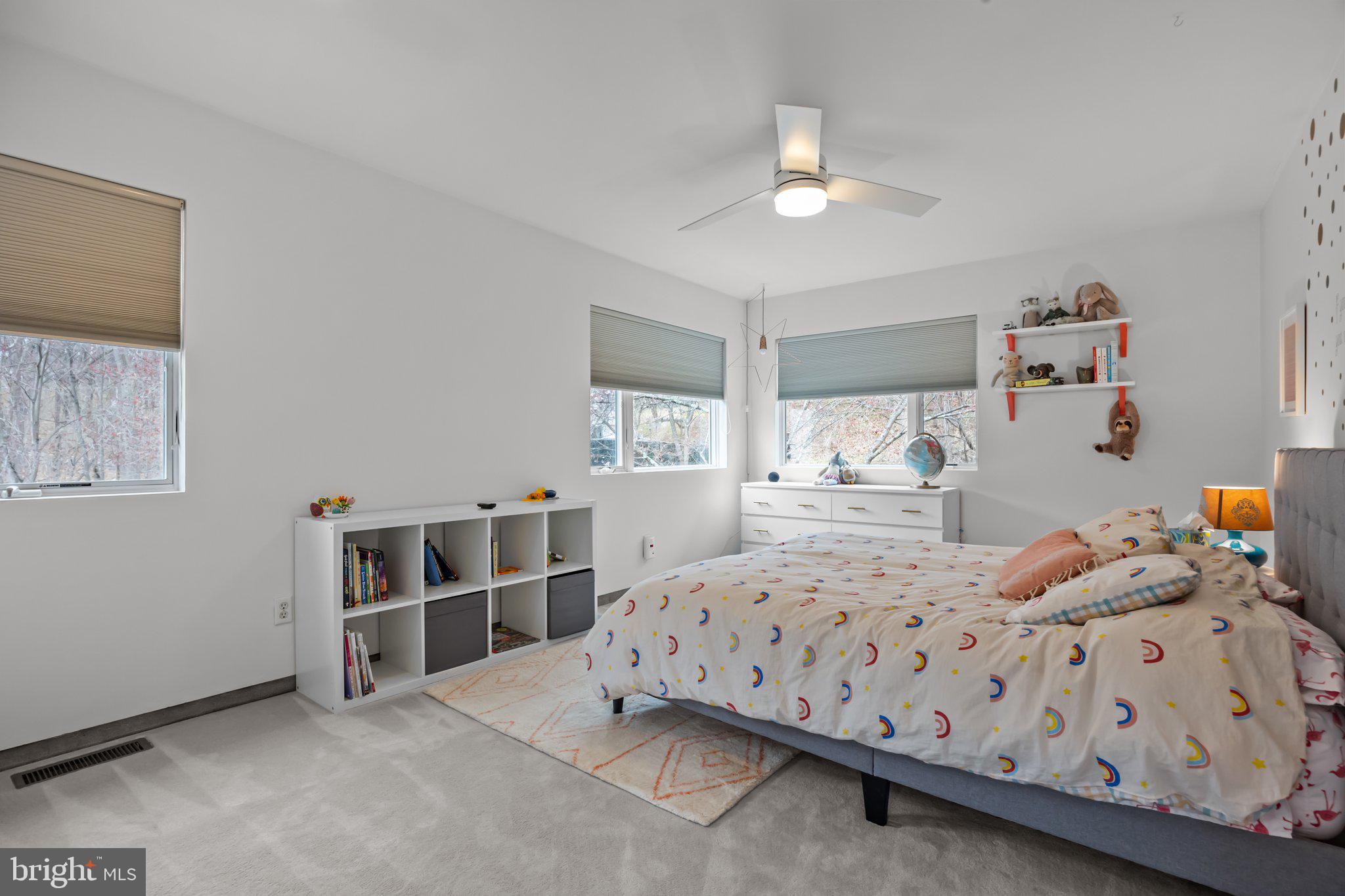 1223 Old Ford Road Huntingdon Valley, PA 19006 - Photo 18 of 36 a bedroom with a bed and a chandelier