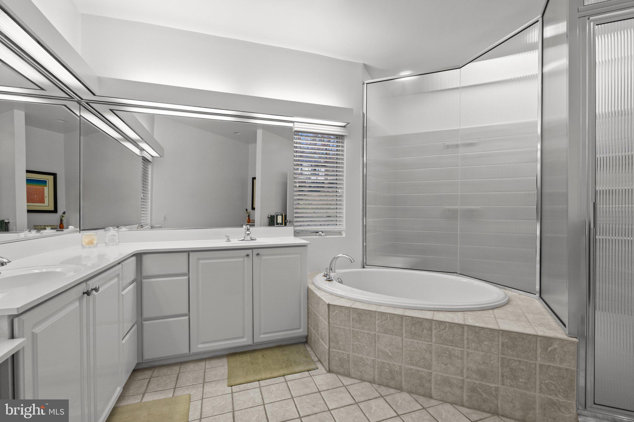 1223 Old Ford Road Huntingdon Valley, PA 19006 - Photo 25 of 36 a bathroom with a tub sink and mirror