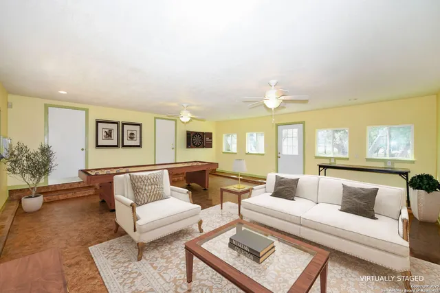 a living room with furniture and a window