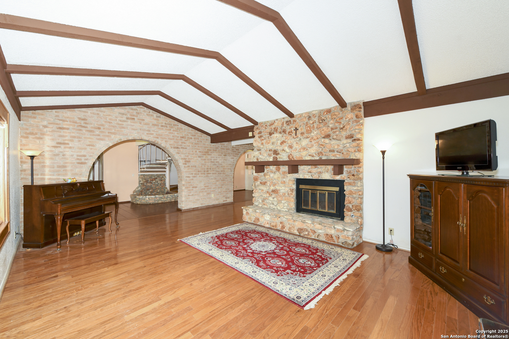 5803 Hollyhock Road San Antonio, TX 78240 - Photo 17 of 51 a living room with furniture and a fireplace