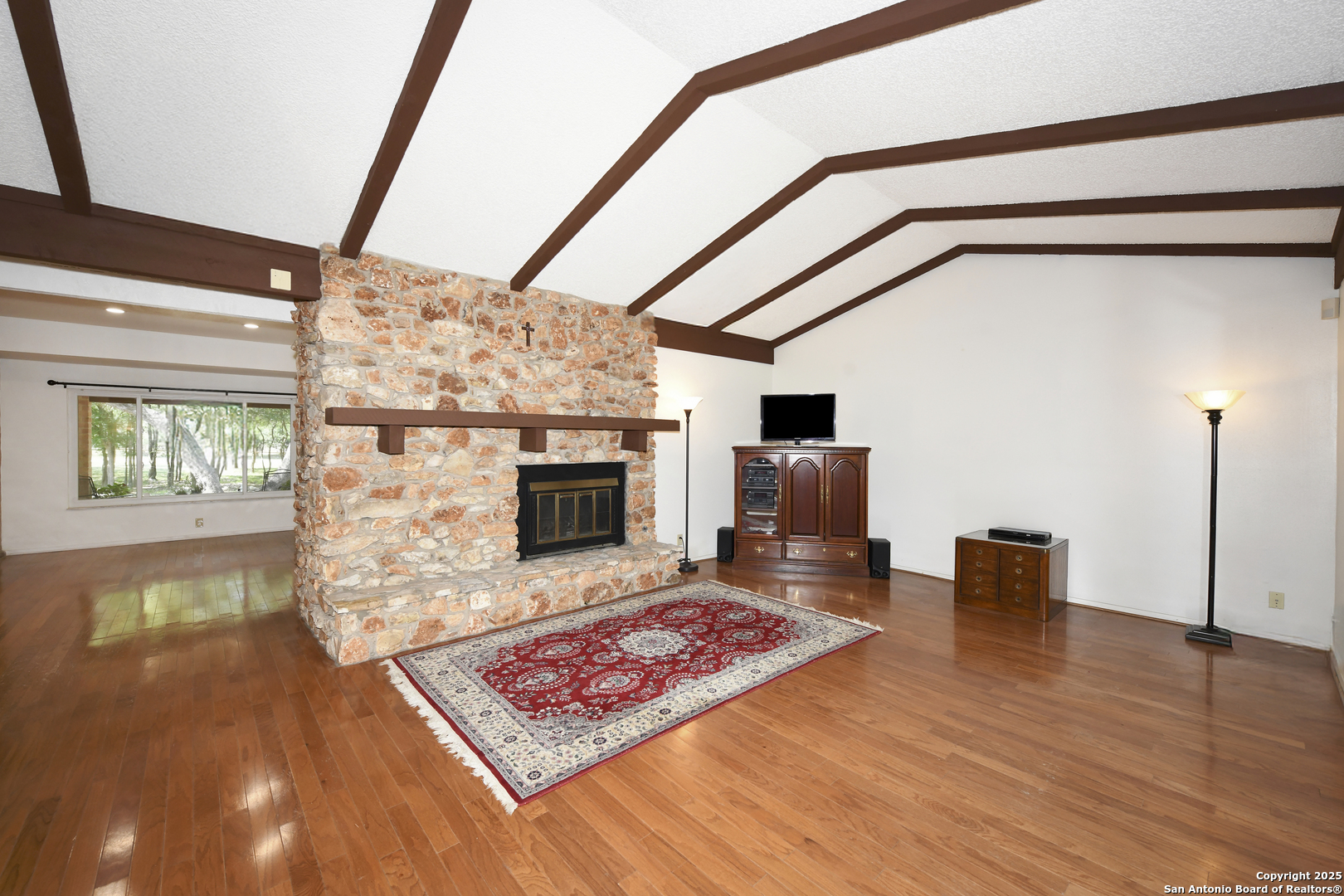 5803 Hollyhock Road San Antonio, TX 78240 - Photo 18 of 51 a living room with furniture and a fireplace