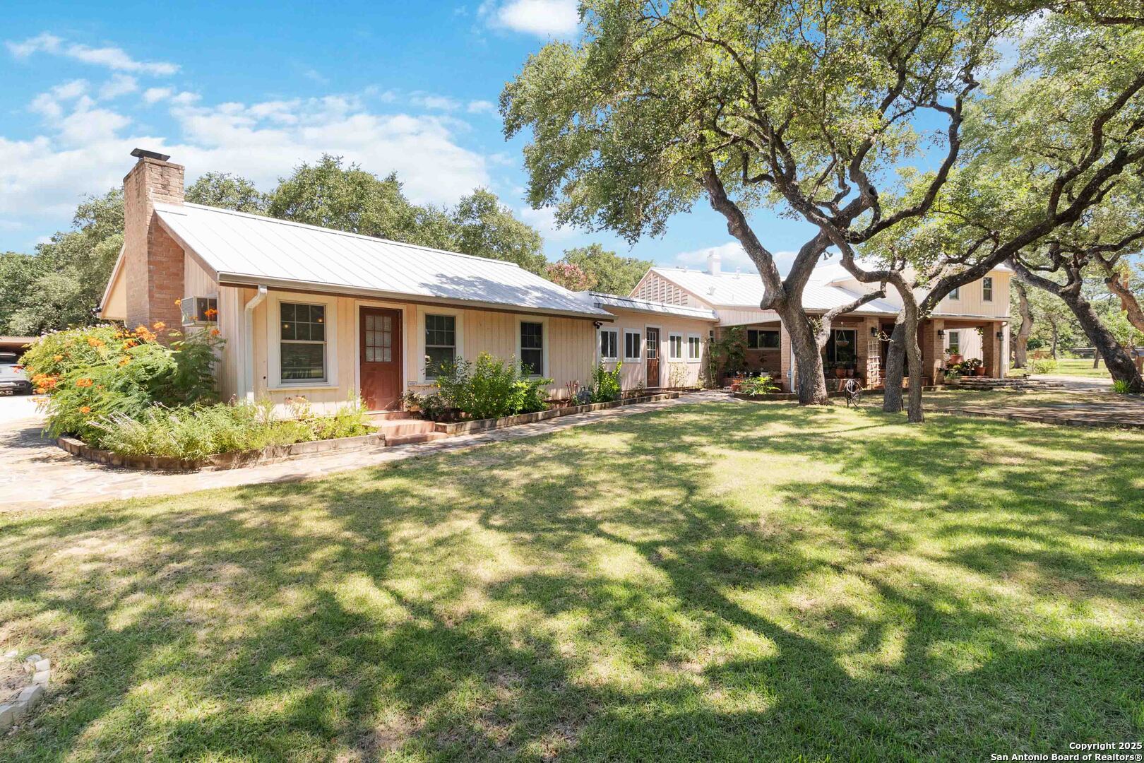 5803 Hollyhock Road San Antonio, TX 78240 - Photo 2 of 51 a front view of house with yard and green space