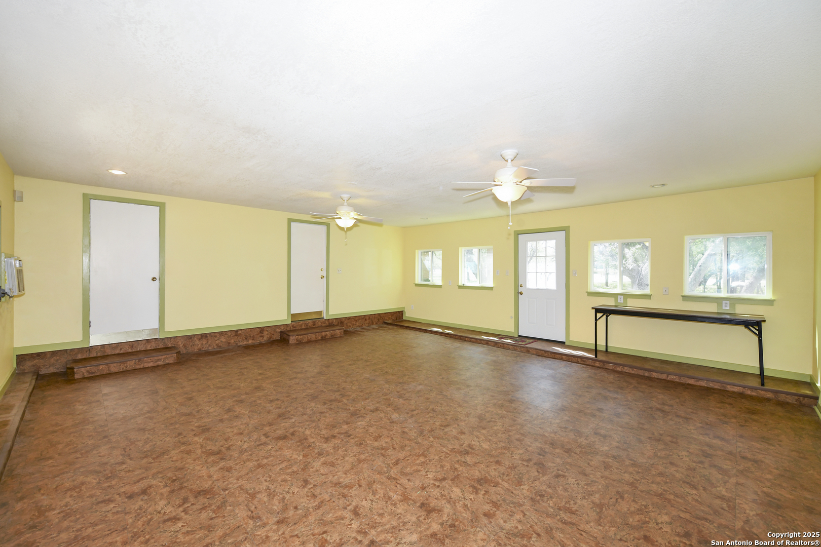 5803 Hollyhock Road San Antonio, TX 78240 - Photo 21 of 51 an empty room with windows and ceiling fan