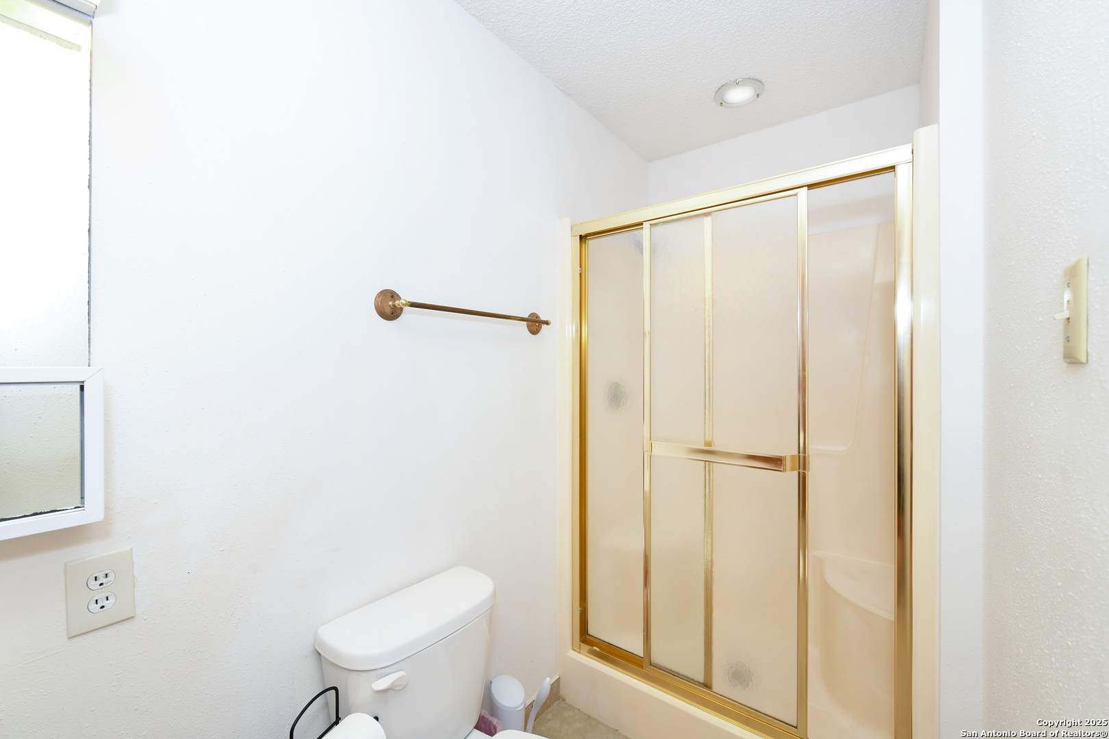 5803 Hollyhock Road San Antonio, TX 78240 - Photo 31 of 51 a bathroom with a toilet a sink and shower
