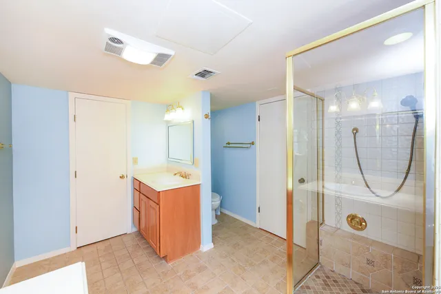 a view of a bathroom with a sink and shower