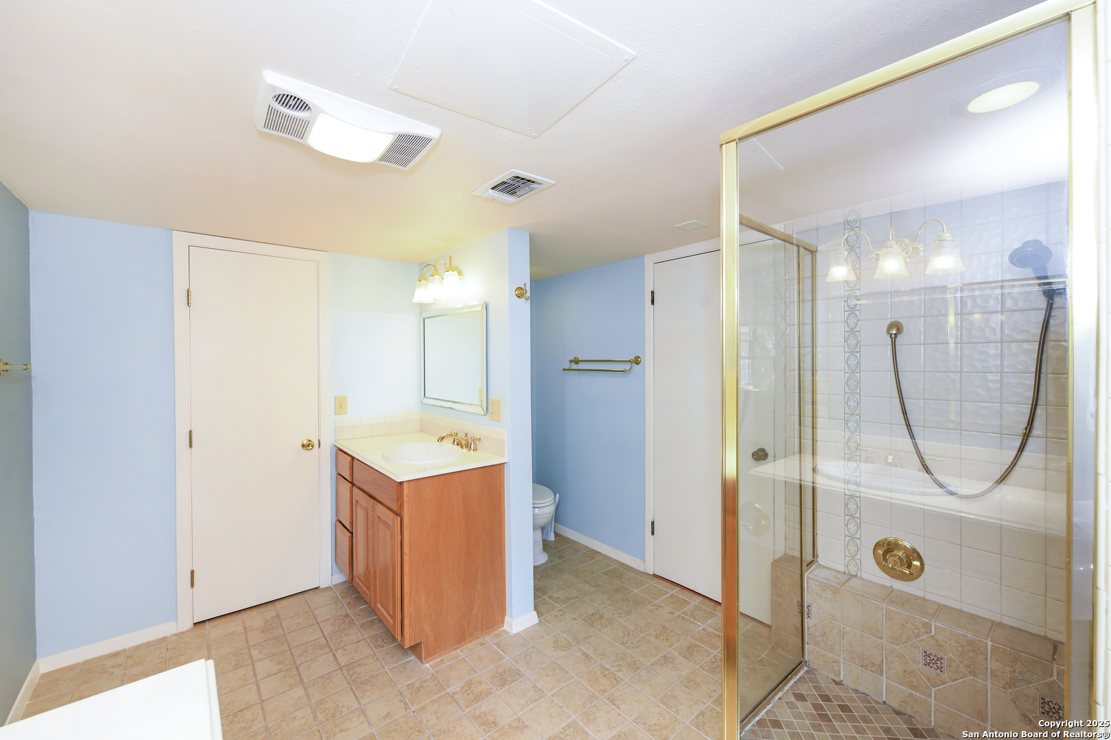 5803 Hollyhock Road San Antonio, TX 78240 - Photo 36 of 51 a view of a bathroom with a sink and shower