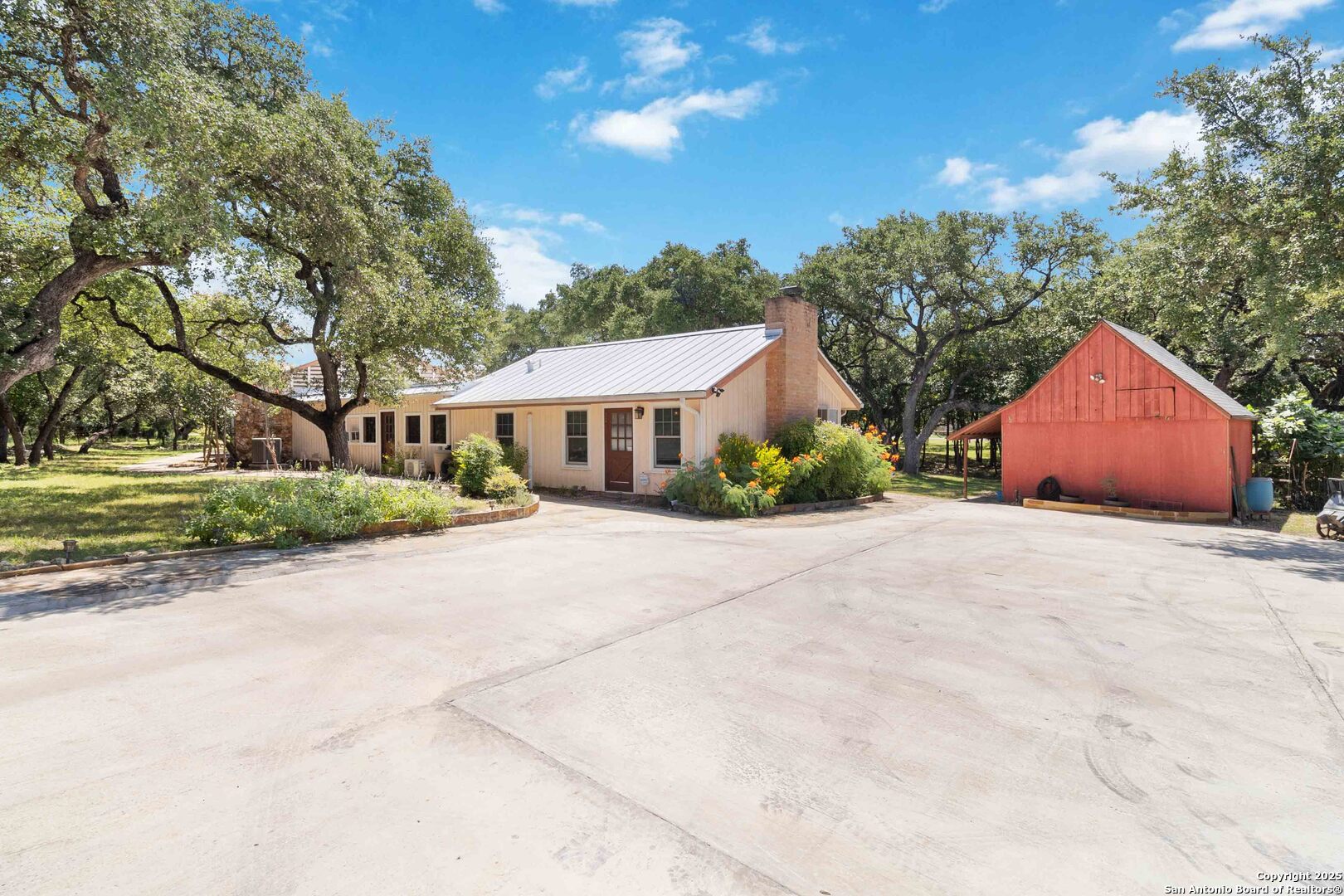 5803 Hollyhock Road San Antonio, TX 78240 - Photo 4 of 51 a front view of a house with garden