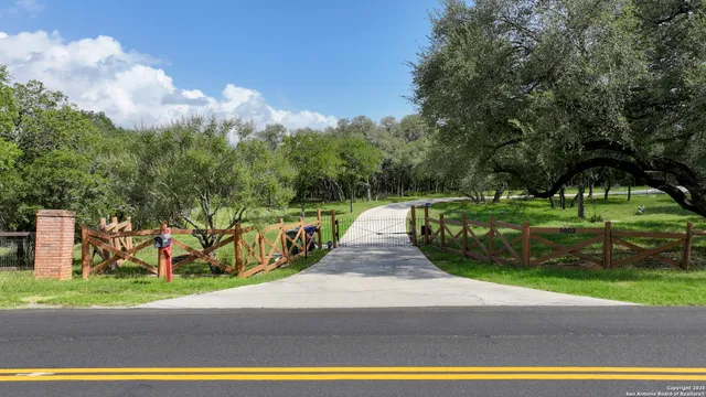an aerial view of a houses with yard
