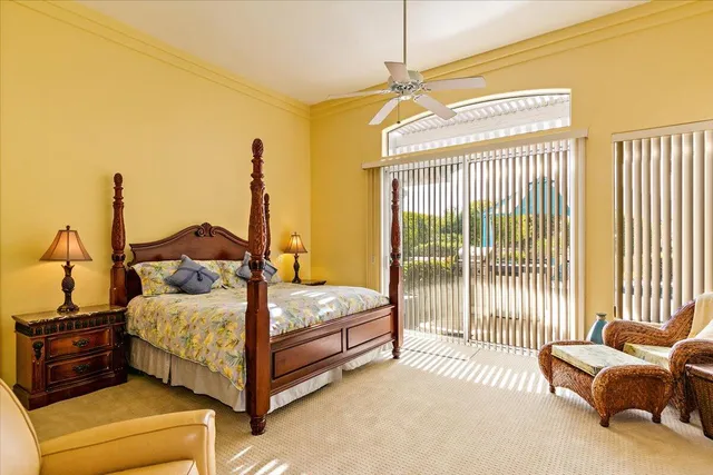 a bedroom with a bed and glass window