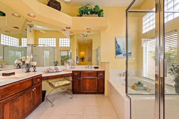 a large kitchen with stainless steel appliances a stove a sink and a refrigerator