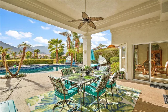 a dining area with furniture and outdoor view