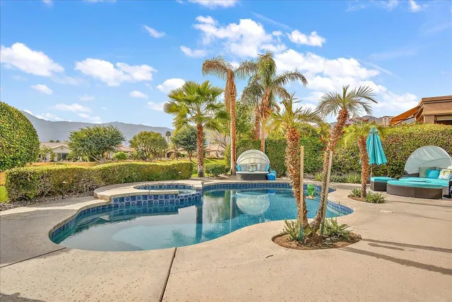 a view of a swimming pool with a patio