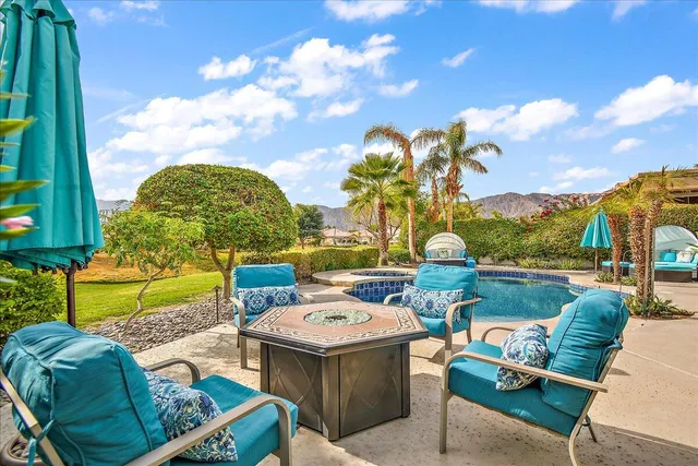 a view of a swimming pool with a lounge chair