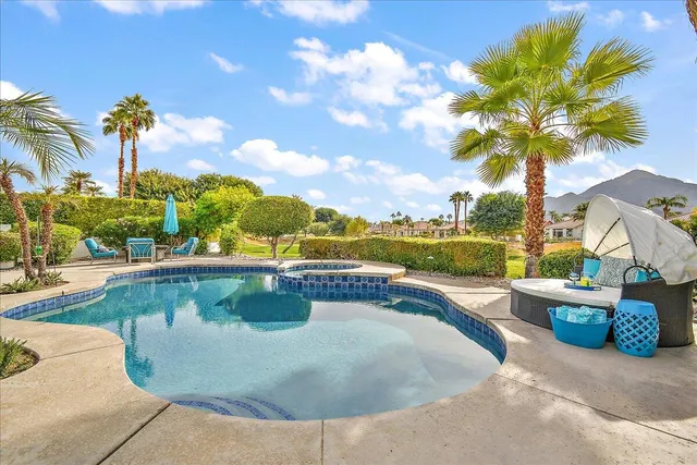 a view of a swimming pool with a patio
