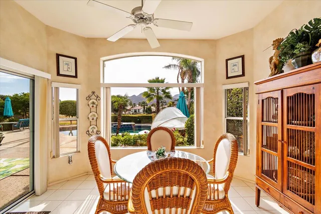 a view of a dining room with furniture window and outside view