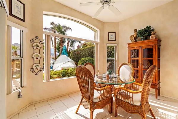 a view of a dining room with furniture window and outside view