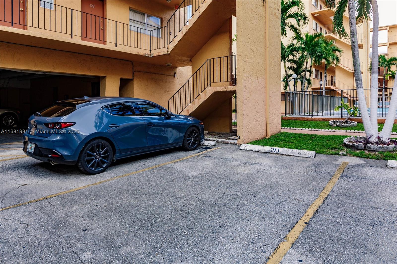 1900 West 54th Street, Unit 213 Hialeah, FL 33012 - Photo 20 of 21 a car parked in front of a house