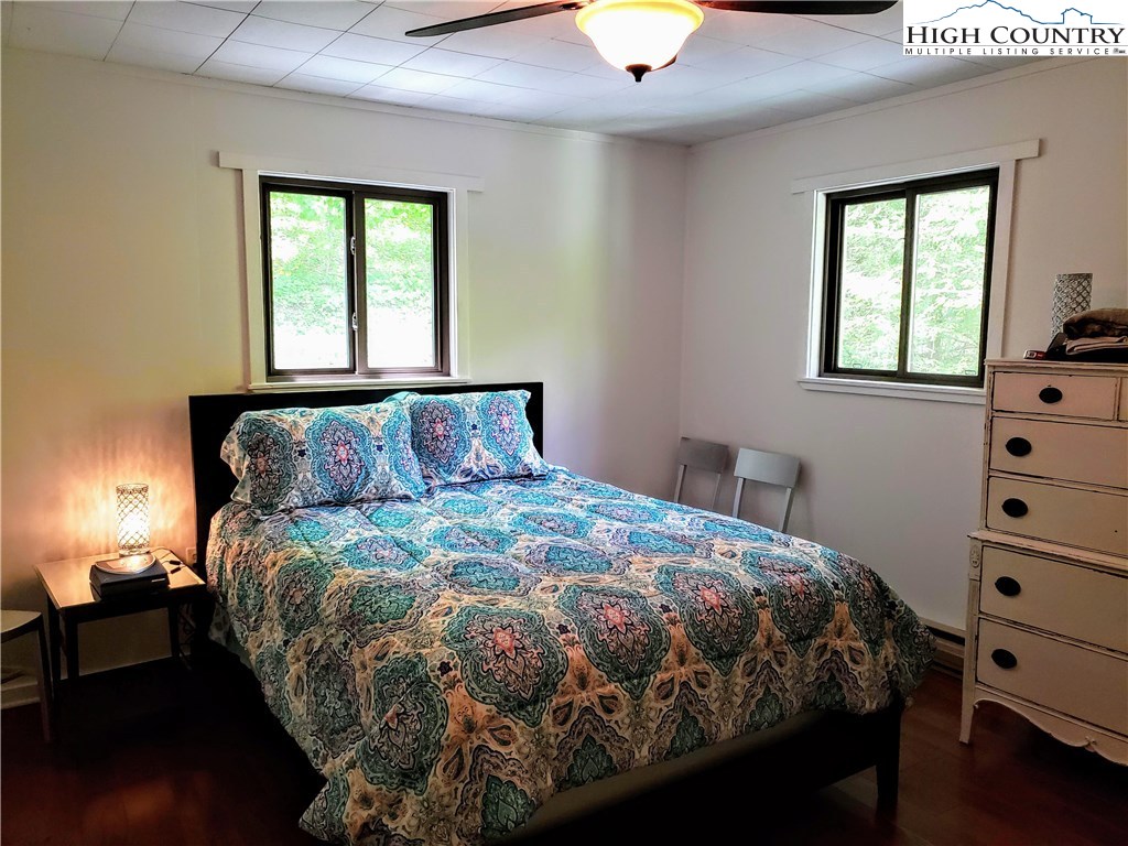 125 Creek Road Boone, NC 28607 - Photo 11 of 32 a bedroom with a bed and window