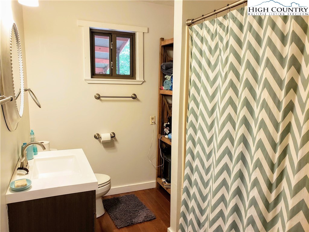 125 Creek Road Boone, NC 28607 - Photo 12 of 32 a bathroom with a sink and a mirror