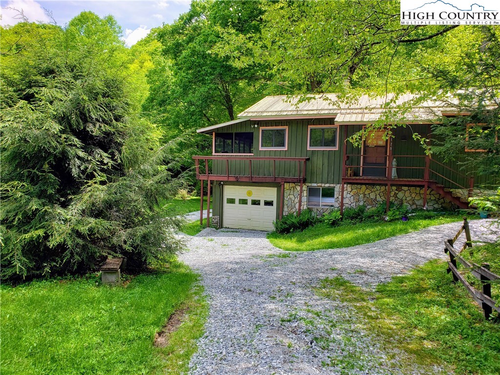 125 Creek Road Boone, NC 28607 - Photo 2 of 32 a front view of a house with garden